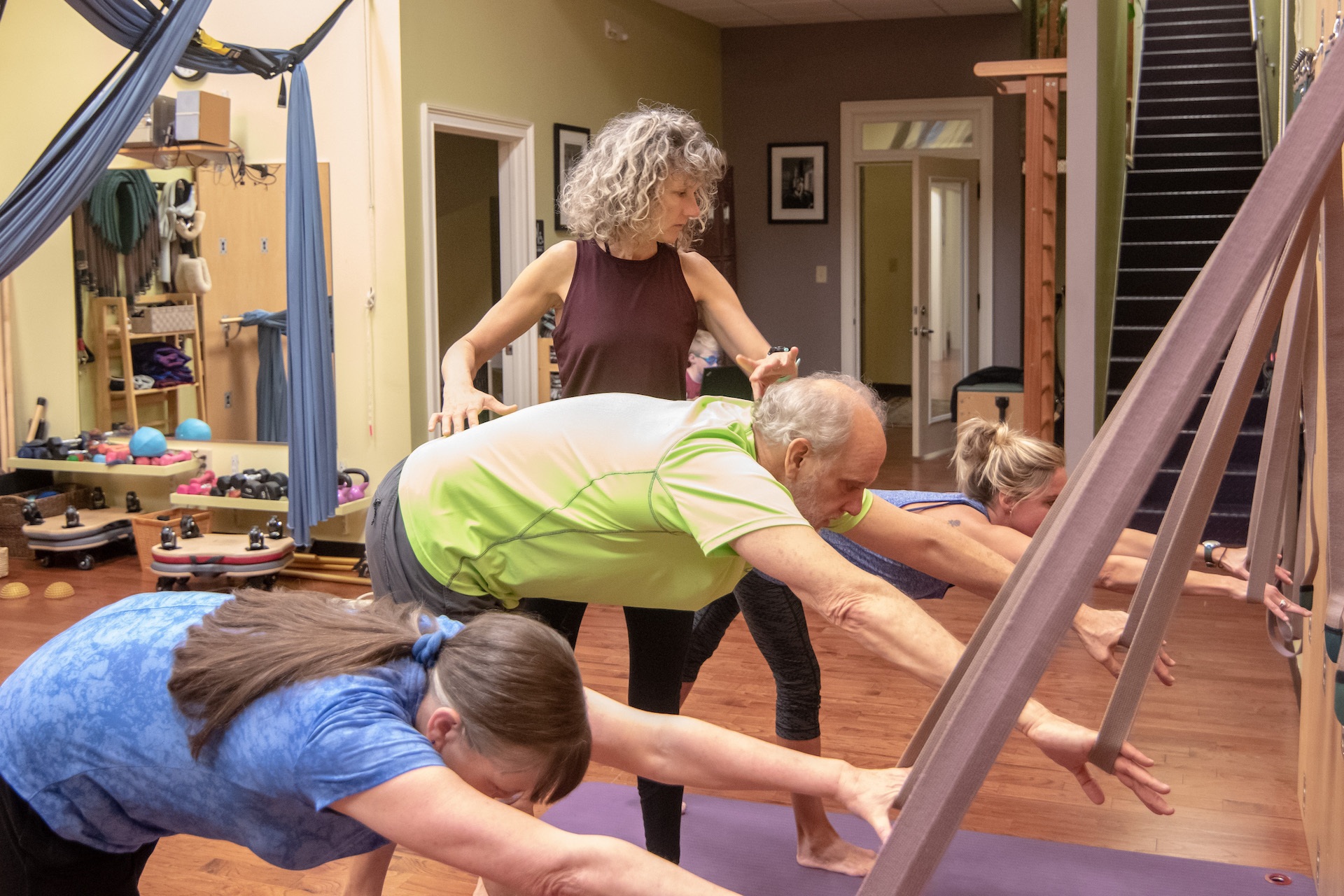 Photo of Pilates Instructor with three clients